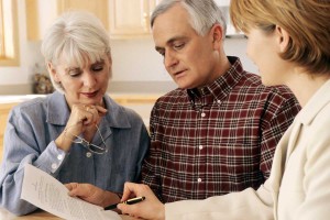 old couple discussing estate planning and risk insurance